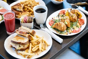 Sandwich and fries spread with breakfast panini – The Skillet NJ